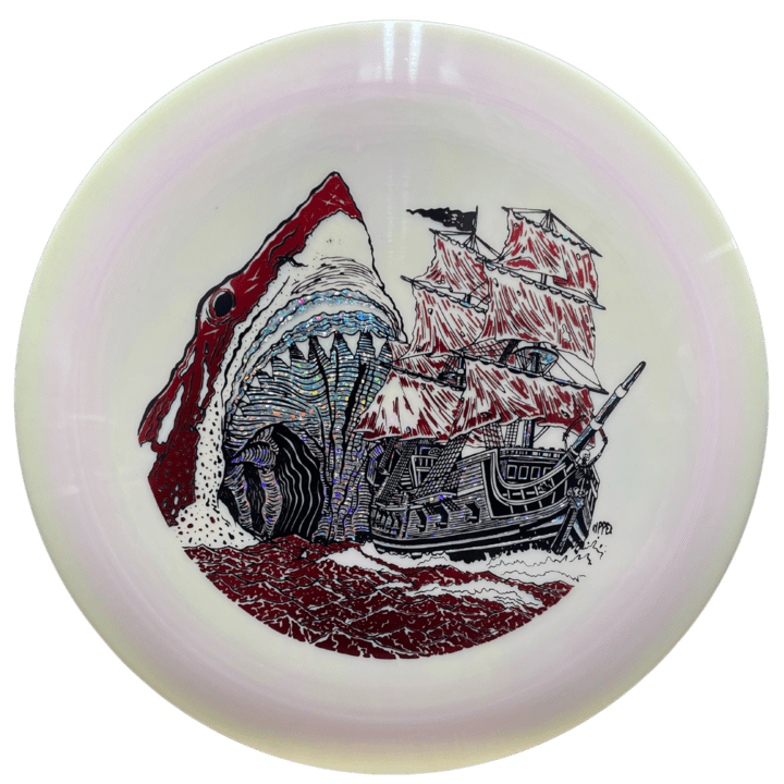 Machete ESP Meg disc golf disc with shark and ship graphic.